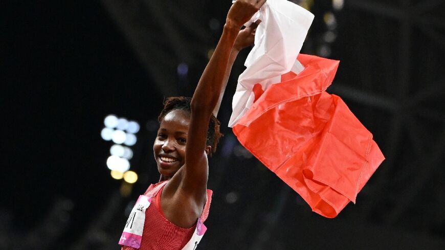 Bahrain world champion Winfred Yavi celebrates winning the Asian Games 3,000m steeplechase