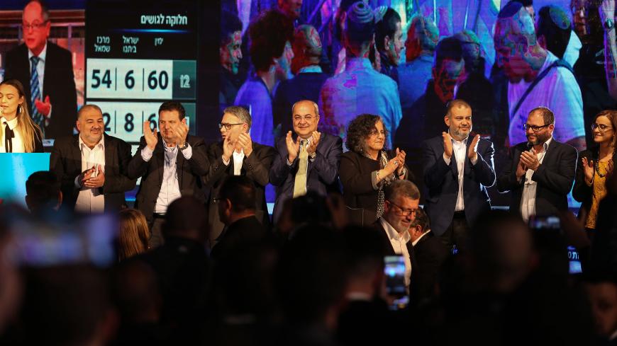 SHEFA AMR, ISRAEL - MARCH 3: Head of the  Joint List Ayman Odeh (2nd L), the members Heba Yazbak (R), Mansour Abbas (L), Mtanes Shehadeh (3rd L), Aida Touma (4th R), Ahmed Tibi (4th L) and Ofer Cassif (2nd R) attend a program  in Israel's northern city of Shefa-Amr on March 2, 2020, after polls officially closed in Israeli general elections. (Photo by Mostafa Alkharouf/Anadolu Agency via Getty Images)