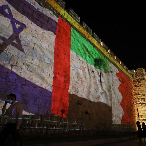 The flags of Israel, United Arab Emirates, and Bahrain are projected on the ramparts of Jerusalem's Old City on September 15, 2020 in a show of support for Israeli normalisation deals with the United Arab Emirates and Bahrain. - Israeli Prime Minister Benjamin Netanyahu signed landmark accords normalizing the Jewish state's relations with the United Arab Emirates and Bahrain, as part of a peace push brokered by US President Donald Trump. (Photo by Menahem KAHANA / AFP) (Photo by MENAHEM KAHANA/AFP via Getty