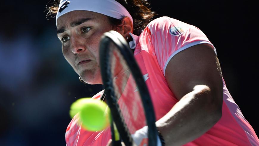 Tunisia's Ons Jabeur hits a return against Japan's Naomi Osaka during their women's singles match on day five of the Australian Open tennis tournament in Melbourne on February 12, 2021. (Photo by Paul CROCK / AFP) / -- IMAGE RESTRICTED TO EDITORIAL USE - STRICTLY NO COMMERCIAL USE -- (Photo by PAUL CROCK/AFP via Getty Images)