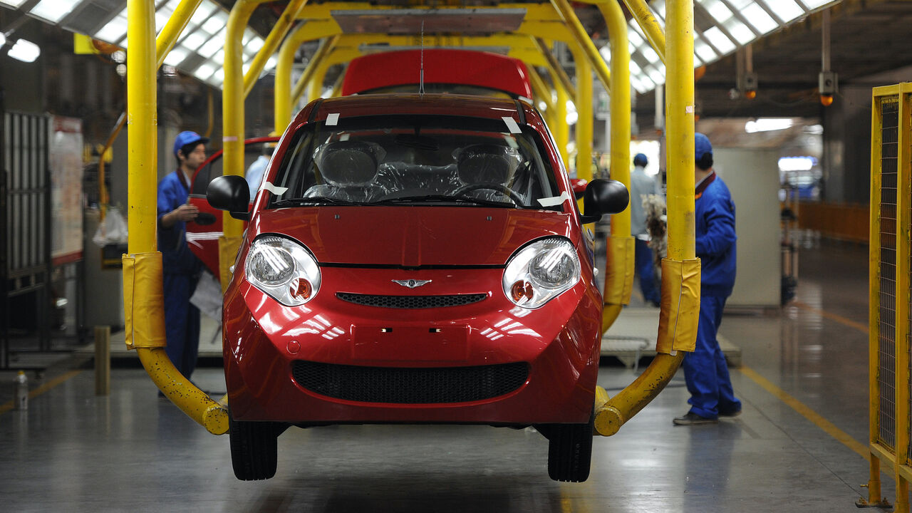 In this picture taken on October 26, 2011 workers assemble one of the many car models at Chinese carmaker's Chery Automobile plant in Wuhu, east China's Anhui province. The growth of China's car market will be driven primarily by exports this year because domestic sales have slowed dramatically, as the world's largest car market -- sold 614,000 cars abroad in the first nine months of 2011, a 60 percent rise on the same period in 2010. CHINA OUT AFP PHOTO (Photo credit should read STR/AFP via Getty Images)