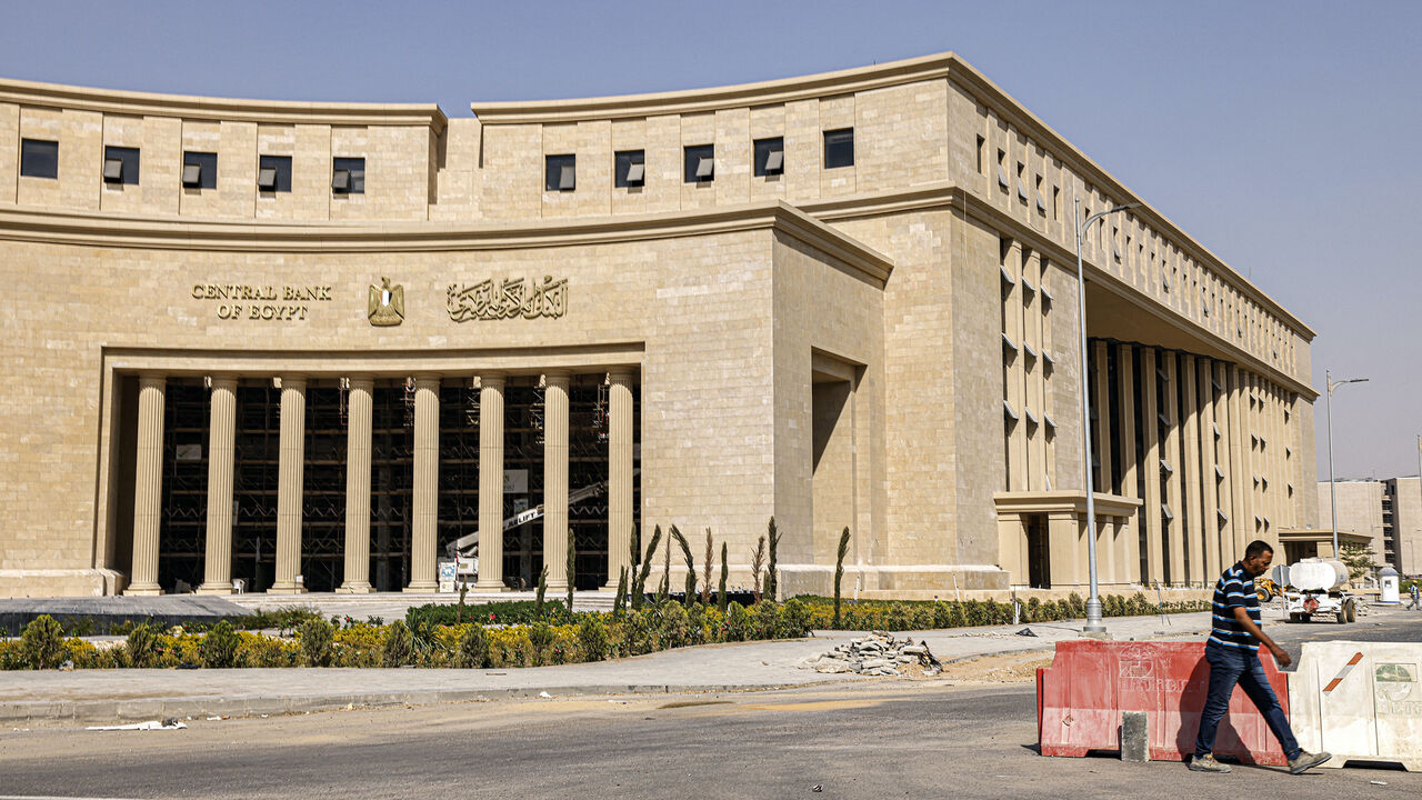 A man walks near the new headquarters of Egypt's Central Bank at the New Administrative Capital megaproject about 45 kilometres east of the current capital Cairo on Aug. 1, 2023. 