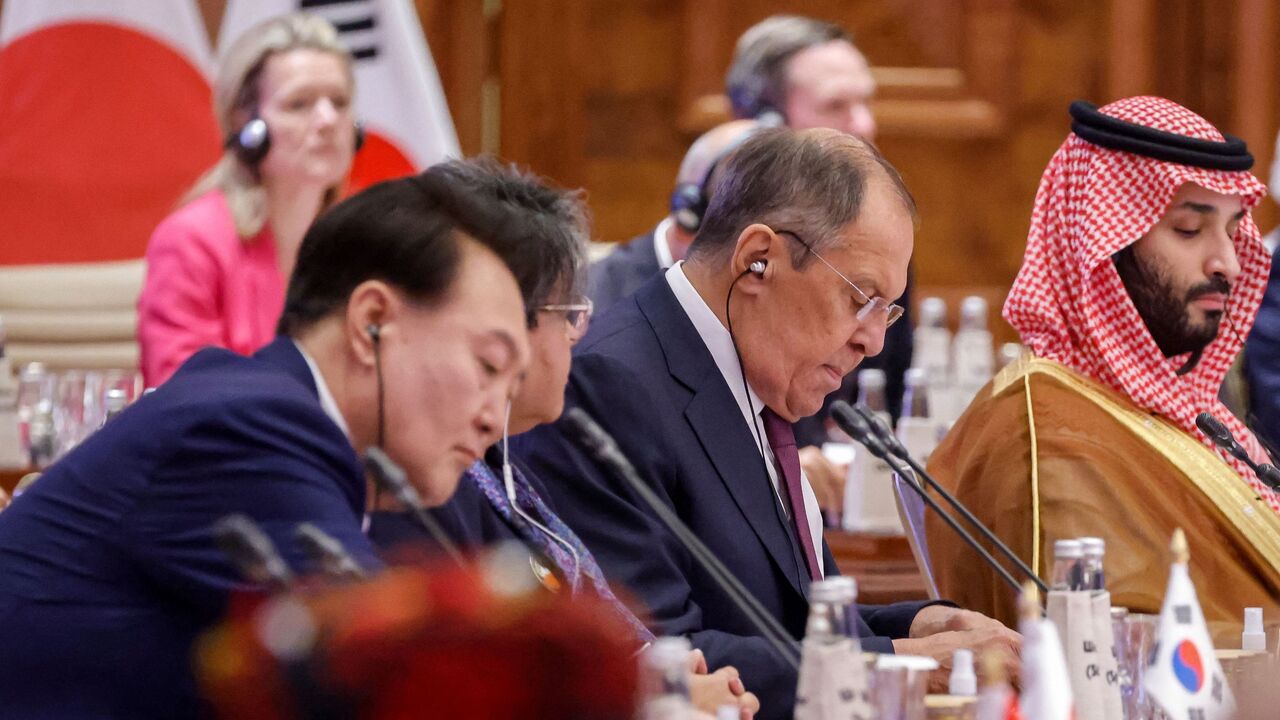 Russian Foreign Minister Sergei Lavrov (C) and Saudi Arabia's Crown Prince and Prime Minister Mohammed bin Salman (2L) attend the first session of the G20 Leaders' Summit at the Bharat Mandapam in New Delhi on Sept. 9, 2023. 