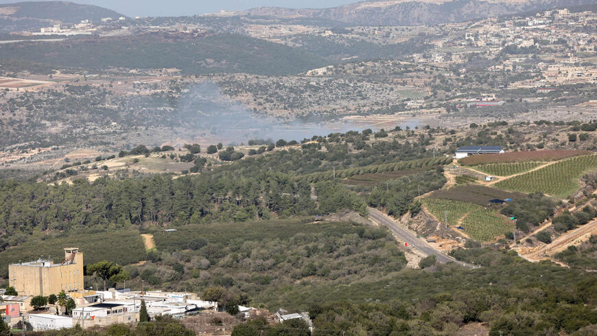 Smoke billows from an area targeted in a rocket strike by Lebanese Hezbollah militants near Israel's border with Lebanon, amid increasing cross-border tensions as fighting continues with Hamas militants in the southern Gaza Strip, Nov. 23, 2023.