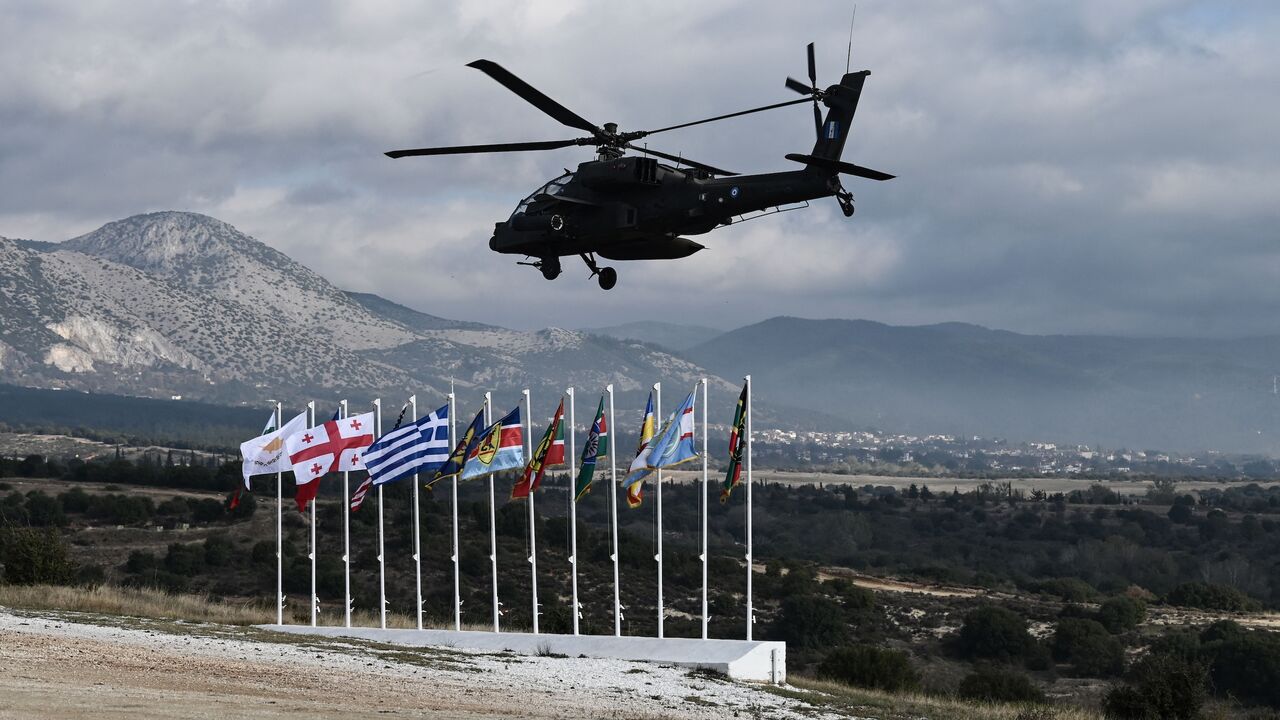 A Hellenic air force helicopter flies during the Olympic Cooperation 23 exercise at the Petrochori training area, near Xanthi, northern Greece, on Nov. 24, 2023.