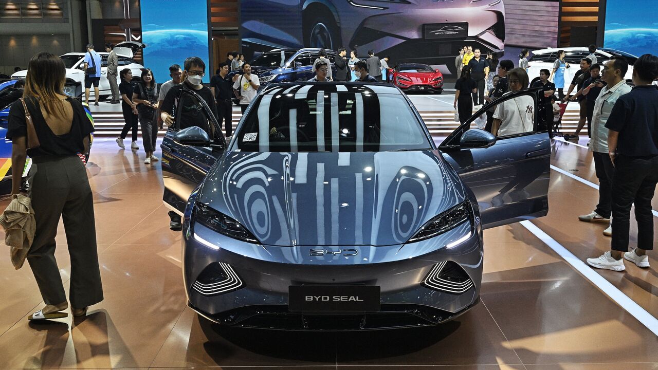 People look at a BYD Seal car by Chinese electric vehicle (EV) manufacturer BYD Auto at the Bangkok International Motor Show in Nonthaburi, March 27, 2024.