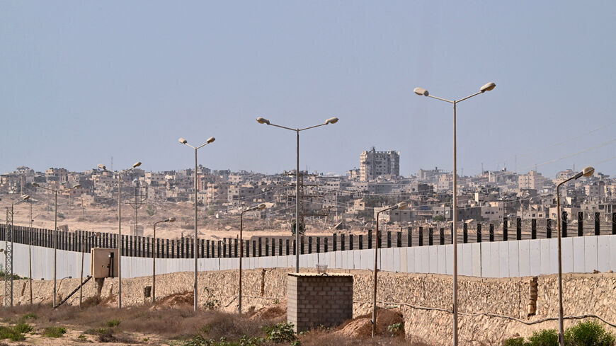 This picture taken from the Egyptian side of the border with the Gaza Strip, shows the war-ravaged city of Rafah on July 4, 2024, as the conflict between Israel and the Palestinian militant group Hamas continues.