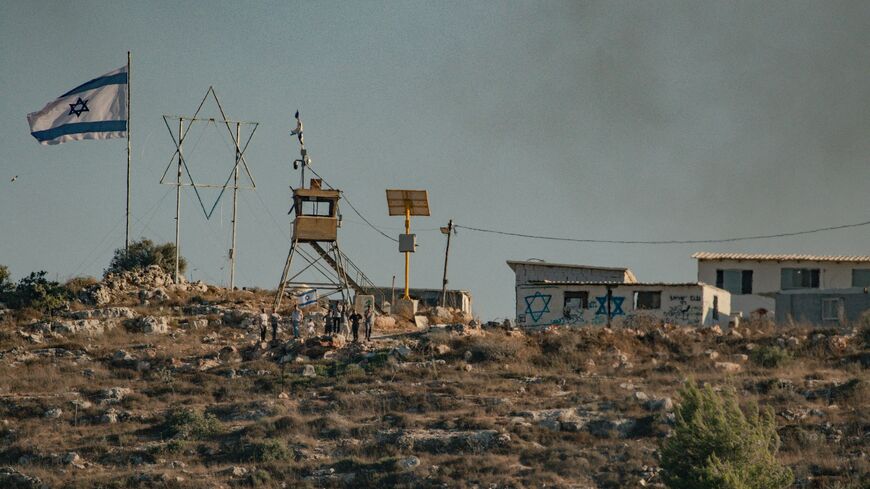 An Israeli check point in the region at the scene as in the presence of armed Israeli forces, settlers attack the industrial area of the town of Beita and set fire to some Palestinian properties in the West Bank on August 2, 2024. 