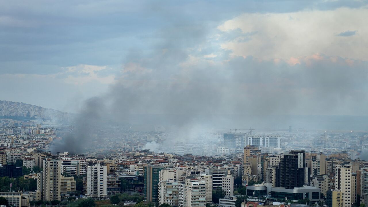 Smoke billows at the site of Israeli airstrikes in a south Beirut suburb, early on Oct. 2, 2024.