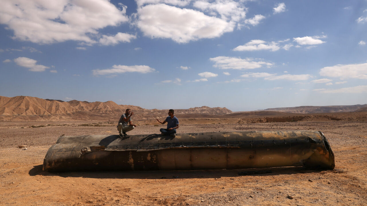 This picture shows the remains of an Iranian missile on the ground in the Negev desert near Arad, on October 2, 2024, in the aftermath of an Iranian missile attack on Israel. Israel vowed to make Iran "pay" for firing a barrage of missiles at its territory, with Tehran warning on October 2 it would launch an even bigger attack it is targeted. (Photo by Menahem KAHANA / AFP) (Photo by MENAHEM KAHANA/AFP via Getty Images)