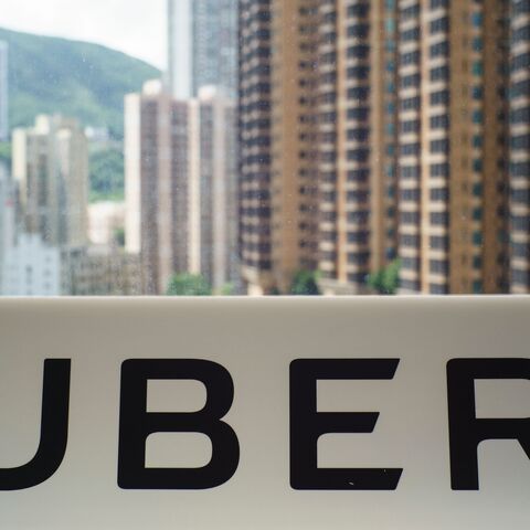 A sign with an Uber logo is seen in the smartphone ride-hailing giant's office in Hong Kong on July 13, 2017.