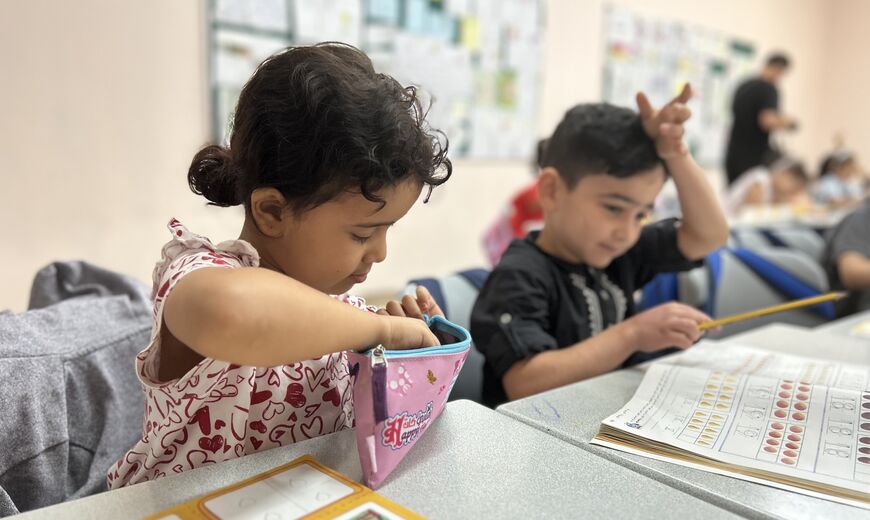 Muatassim, right, attends school with other children from Gaza. Photo credit: Jennifer Gnana