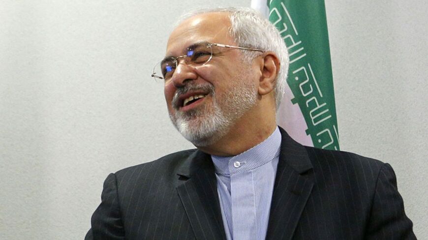 Foreign Minister of Iran Mohammad Javad Zarif reacts during a family photo session at the Caspian Sea littoral states conference in Moscow, April 22, 2014. REUTERS/Maxim Shemetov (RUSSIA - Tags: POLITICS) - RTR3M6F5