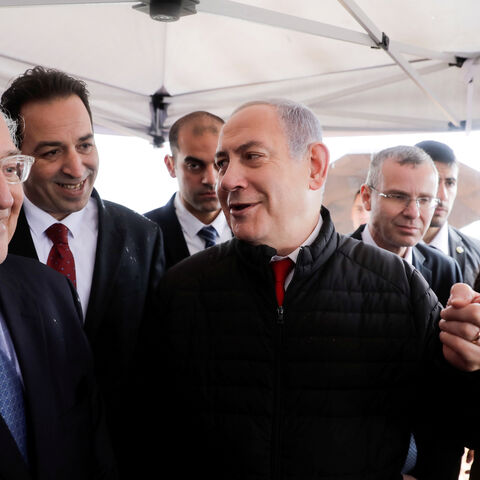 Israeli Prime Minister Benjamin Netanyahu talks to the U.S. Ambassador David Friedman during his visit to Ariel settlement in the West Bank, February 24, 2020. Sebastian Scheiner/Pool via REUTERS - RC287F98LHX4