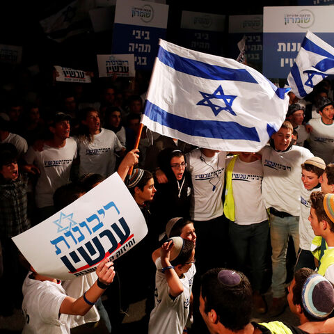 Israeli youth demonstrate as they call on Israeli Prime Minister Benjamin Netanyahu to declare sovereignty over Israel's settlements in the occupied West Bank, in Jerusalem February 13, 2020. The Hebrew writing reading, "Sovereignty Now". Picture taken February 13, 2020. REUTERS/Ronen Zvulun - RC2R7F9731YP