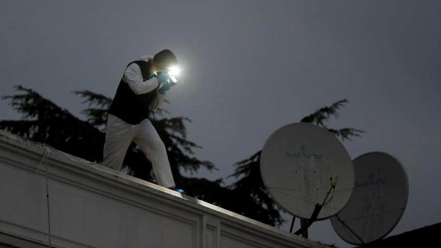 Turkish police forensic experts examine the roof of the residence of Saudi Arabia's Consul General Mohammad al-Otaibi as a part of the Saudi journalist Jamal Khashoggi investigation, in Istanbul, Turkey October 17, 2018. REUTERS/Osman Orsal - RC16743EB6C0