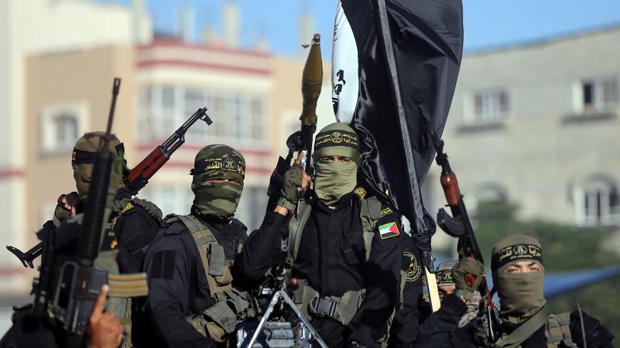 Palestinian Islamic jihad militants take part in a military show marking the 32nd anniversary of the organisation's founding, in the central Gaza Strip October 3, 2019. REUTERS/Ibraheem Abu Mustafa - RC17E1BD1920